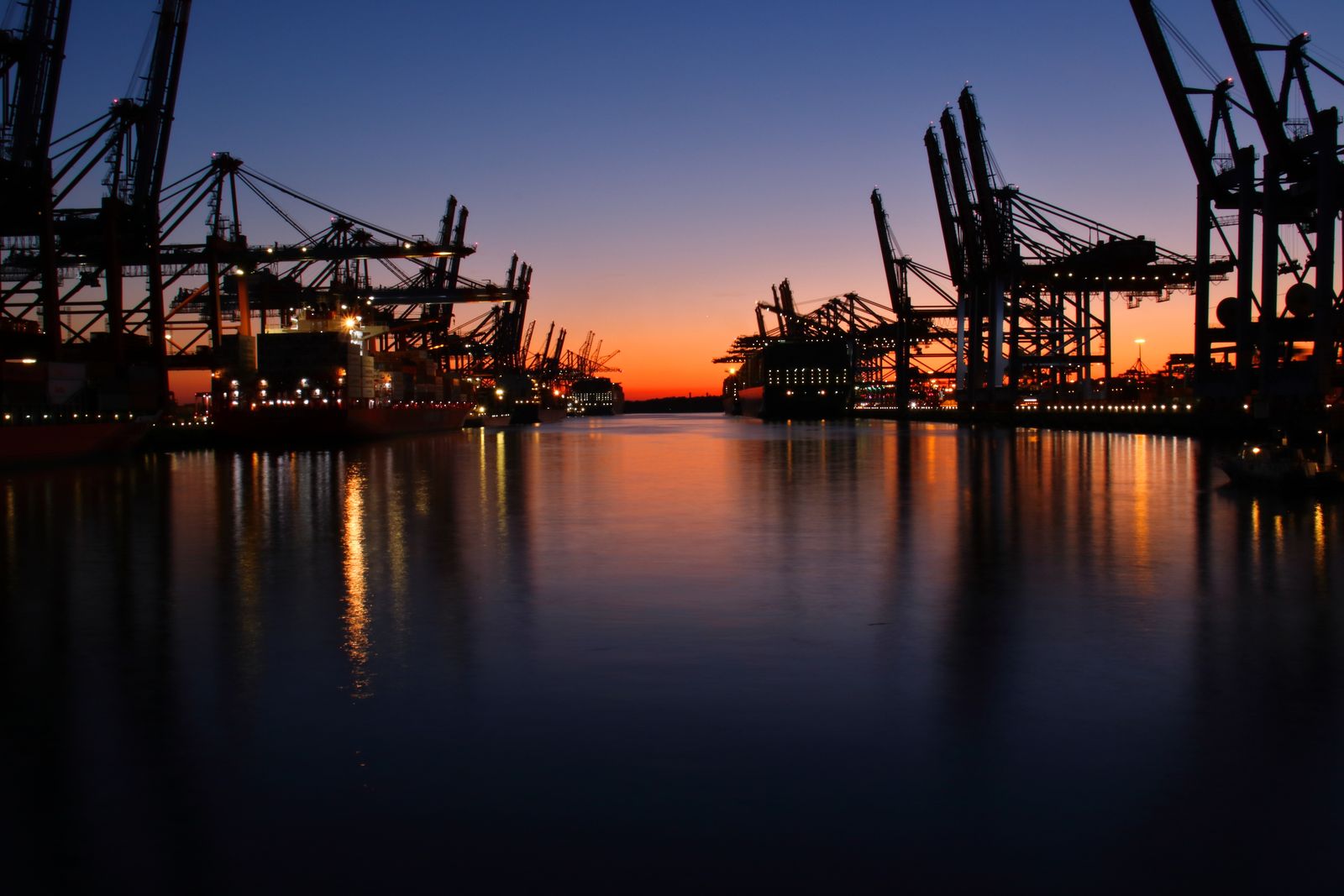 A container port at work at golden hour
